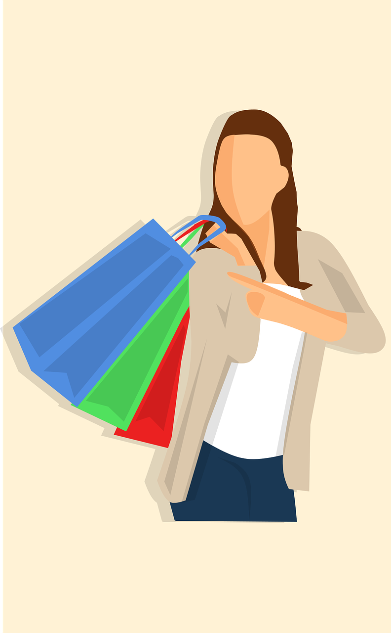 Woman holding four shopping bags