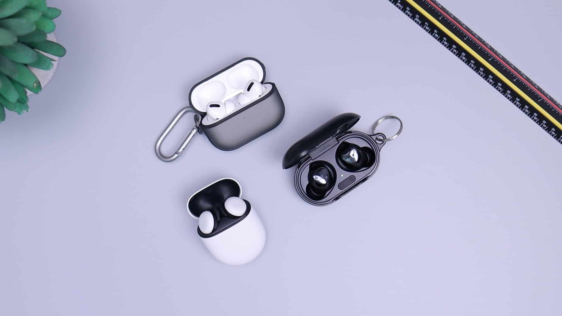 Three wireless earbuds and their cases