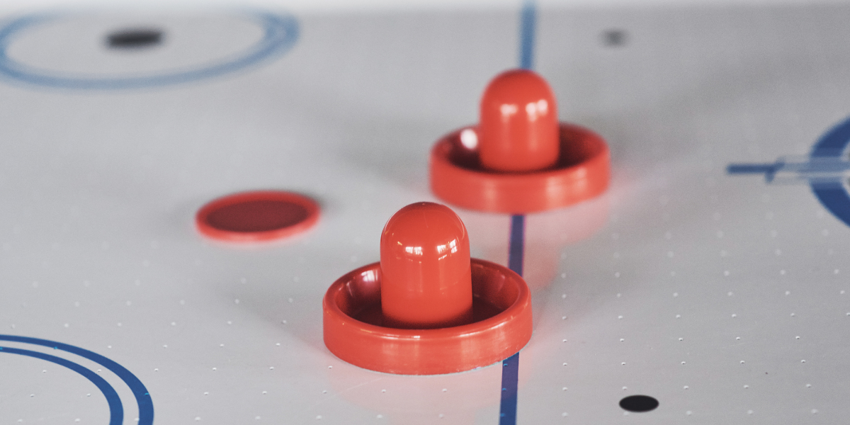 Air Hockey Table pushers on its surface