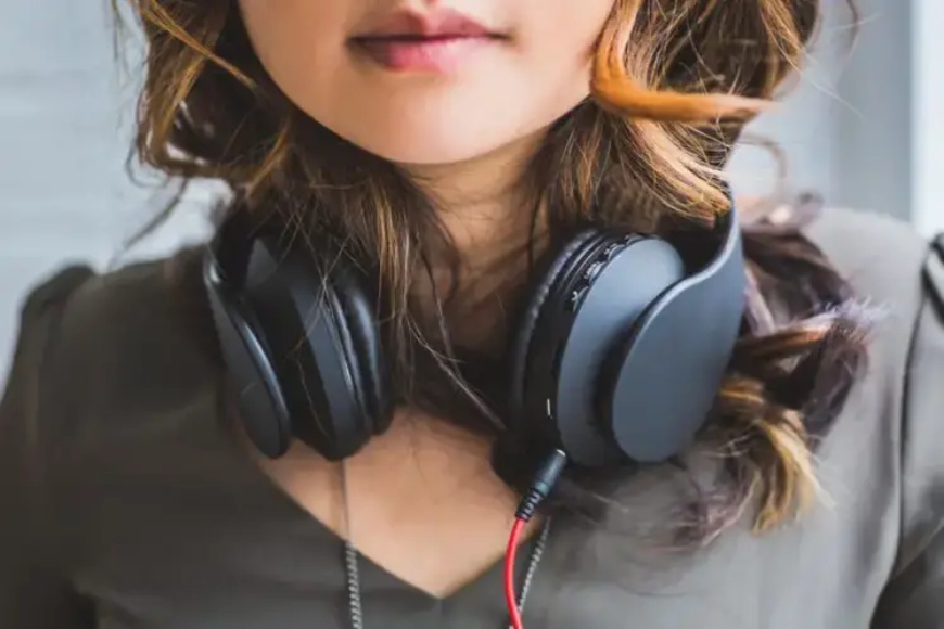 A girl wearing wired headphones